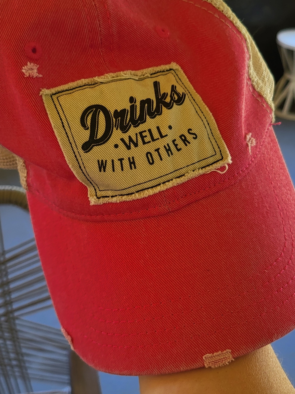 Pink Trucker Hat with 'Drinks Well With Others' Patch